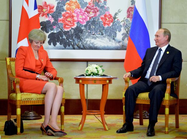 Russian President Vladimir Putin, right, listens to British Prime Minister Theresa May during a bilateral meeting in Hangzhou, China, Sunday, Sept. 4, 2016, ahead of the G20 Leaders Summit. Russian President Vladimir Putin, right, listens to British Prime Minister Theresa May during a bilateral meeting in Hangzhou, China, Sunday, Sept. 4, 2016, ahead of the G20 Leaders Summit. - Sputnik International