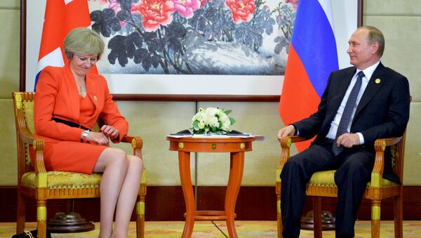 Russian President Vladimir Putin, right, listens to British Prime Minister Theresa May during a bilateral meeting in Hangzhou, China, Sunday, Sept. 4, 2016, ahead of the G20 Leaders Summit. - Sputnik International