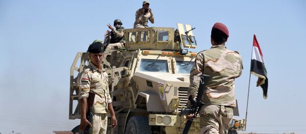 Iraqi government forces drive down a road leading to Tal Afar on June 9, 2017, during ongoing battles to retake the city from Islamic State (IS) group fighters Iraqi government forces drive down a road leading to Tal Afar on June 9, 2017, during ongoing battles to retake the city from Islamic State (IS) group fighters - Sputnik International