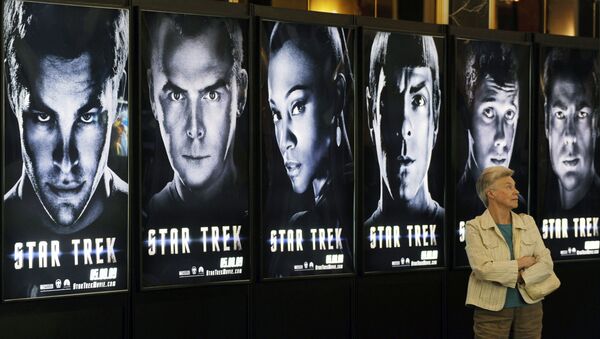A visitor walks past a line of posters for the forthcoming film Star Trek, on the first day of ShoWest, the largest annual convention for the motion picture industry, Monday, March 30, 2009, in Las Vegas - Sputnik International