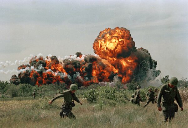 A napalm strike erupts in a fireball near U.S. troops on patrol in South Vietnam, 1966 during the Vietnam War A napalm strike erupts in a fireball near U.S. troops on patrol in South Vietnam, 1966 during the Vietnam War - Sputnik International
