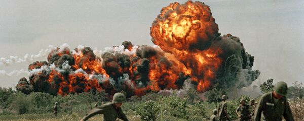 A napalm strike erupts in a fireball near U.S. troops on patrol in South Vietnam, 1966 during the Vietnam War A napalm strike erupts in a fireball near U.S. troops on patrol in South Vietnam, 1966 during the Vietnam War - Sputnik International