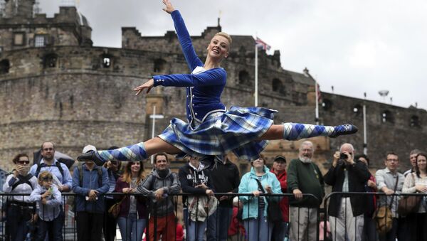 Highland Dancer Elayne Seaton from the Tattoo Dance Company performs on the Edinburgh Castle esplanade after the Royal Edinburgh Military Tattoo programme was revealed by Brigadier David Allfrey, chief executive and producer of the Tattoo, in Edinburgh - Sputnik International