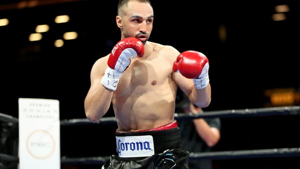 Paul Malignaggi in action against Danny Garcia during their welterweight fight at the Barclays Center in Brooklyn, on Saturday, August 1, 2015. - Sputnik International