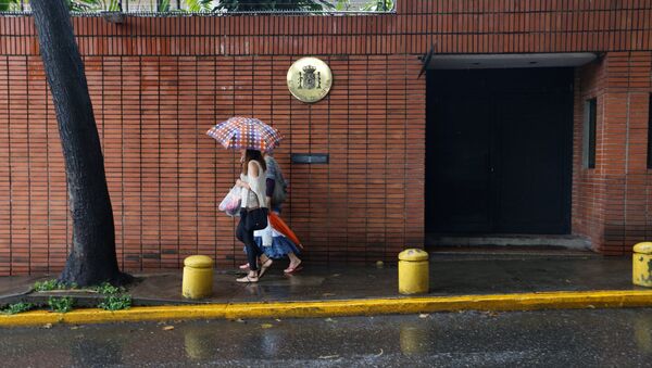 Pedestrians pass next to the Spanish embassy in Caracas, Venezuela - Sputnik International