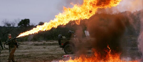 Sunni Michael demonstrates a flamethrower that will be used in a re-enactment of the battle of Iwo Jima, marking the 60th anniversary, on a Hill Country ranch in Doss, Texas. (File) Sunni Michael demonstrates a flamethrower that will be used in a re-enactment of the battle of Iwo Jima, marking the 60th anniversary, on a Hill Country ranch in Doss, Texas. (File) - Sputnik International