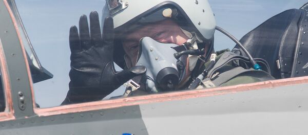 Ukrainian President Petro Poroshenko waves from the cockpit of a MiG-29 fighter jet before taking off from the military airfield in the village of Vasylkiv, outside Kiev, Ukraine - Sputnik International