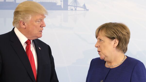 U.S. President Donald Trump, left, and German Chancellor Angela Merkel pose for a photograph prior to a bilateral meeting on the eve of the G-20 summit in Hamburg, northern Germany, Thursday, July 6, 2017 - Sputnik International