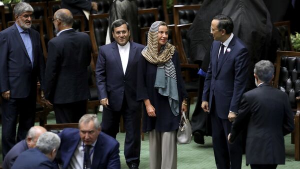 European Union foreign policy chief Federica Mogherini, center, attends the swearing-in ceremony of President Hasan Rouhani for the second term in office, at the parliament in Tehran, Iran, Saturday, Aug. 5, 2017 - Sputnik International