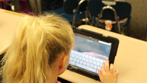 A child using a tablet - Sputnik International
