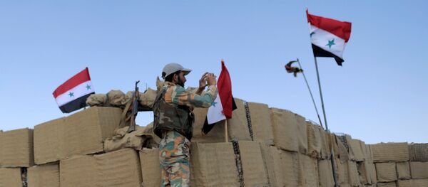 Syrian soldiers loyal to Syria's President Bashar al-Assad forces are seen in Fleita, Syria August 2, 2017 Syrian soldiers loyal to Syria's President Bashar al-Assad forces are seen in Fleita, Syria August 2, 2017 - Sputnik International