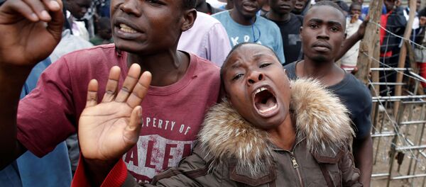 A woman cries after a supporter of opposition leader Raila Odinga was killed by police, witnesses said, in Mathare slum in Nairobi, Kenya August 9, 2017. A woman cries after a supporter of opposition leader Raila Odinga was killed by police, witnesses said, in Mathare slum in Nairobi, Kenya August 9, 2017. - Sputnik International