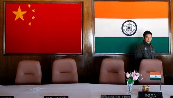 A man walks inside a conference room used for meetings between military commanders of China and India, at the Indian side of the Indo-China border at Bumla, in the northeastern Indian state of Arunachal Pradesh, November 11, 2009 - Sputnik International