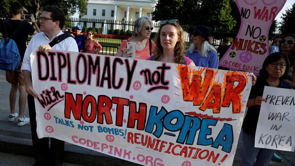 Protesters call for peaceful negotiations with North Korea during a vigil in front of the White House in Washington, U.S., August 9, 2017 - Sputnik International