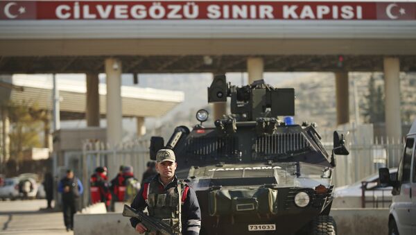 (File) Turkish forces' officers provide security at the Cilvegozu border gate with Syria, near Hatay, southeastern Turkey, Monday, Dec, 19, 2016 - Sputnik International
