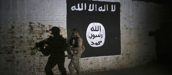 An Iraqi soldier inspects a recently-discovered train tunnel, adorned with an Islamic State group flag, that belonged to the former Baghdad to Mosul line, that was turned it to a training camp for IS fighters, in western Mosul, Iraq, Wednesday, March 1. 2017 - Sputnik International