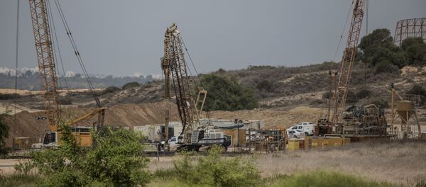 In this Thursday, Sept. 8, 2016 file photo, heavy machinery works on a massive underground barrier on the Israeli side of the border with Gaza - Sputnik International