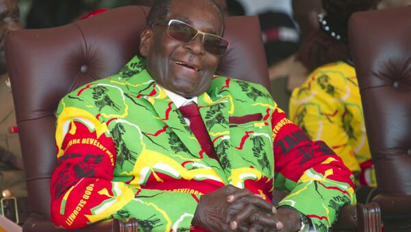 In this Friday June, 2, 2017 file photo Zimbabwean President Robert Mugabe smiles during a youth rally in Marondera, east of Harare. - Sputnik International