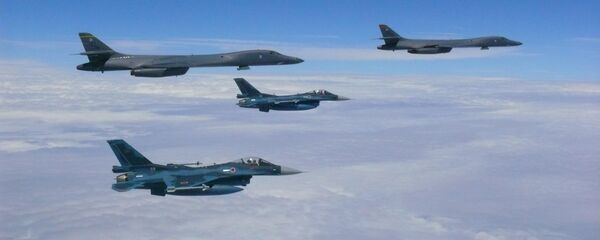 Two U.S. Air Force B-1B Lancers assigned to the 37th Expeditionary Bomb Squadron, deployed from Ellsworth Air Force Base, South Dakota, flew from Andersen Air Force Base, Guam, for a 10-hour mission, flying in the vicinity of Kyushu, Japan, the East China Sea, and the Korean peninsula, Aug. 7, 2017. - Sputnik International