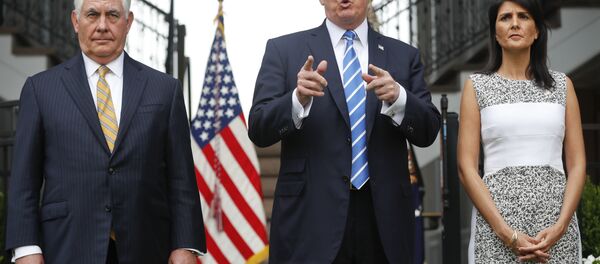 President Donald Trump gestures while speaking following his meeting with Secretary of State Rex Tillerson, left, and U.S. Ambassador to the United Nations Nikki Haley at Trump National Golf Club in Bedminster, N.J., Friday, Aug. 11, 2017. President Donald Trump gestures while speaking following his meeting with Secretary of State Rex Tillerson, left, and U.S. Ambassador to the United Nations Nikki Haley at Trump National Golf Club in Bedminster, N.J., Friday, Aug. 11, 2017. - Sputnik International