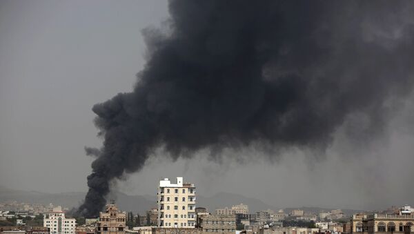 Smoke rises after Saudi-led airstrikes hit a food factory in Sanaa, Yemen. (File) - Sputnik International