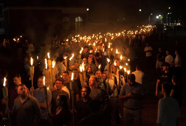 White nationalists carry torches on the grounds of the University of Virginia, on the eve of a planned Unite The Right rally in Charlottesville, Virginia, U.S White nationalists carry torches on the grounds of the University of Virginia, on the eve of a planned Unite The Right rally in Charlottesville, Virginia, U.S - Sputnik International