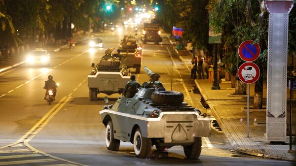 Army vehicles are seen along a street in Phnom Penh, Cambodia - Sputnik International