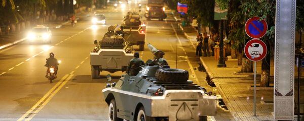 Army vehicles are seen along a street in Phnom Penh, Cambodia Army vehicles are seen along a street in Phnom Penh, Cambodia - Sputnik International