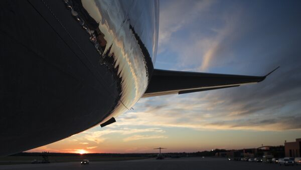 The tail of Air Force One is seen on the tarmac as the sun sets - Sputnik International