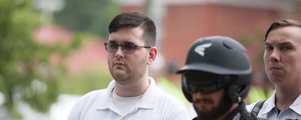 James Alex Fields Jr., (L) is seen attending the Unite the Right rally in Emancipation Park before being arrested by police and charged with charged with one count of second degree murder, three counts of malicious wounding and one count of failing to stop at an accident that resulted in a death after police say he drove a car into a crowd of counter-protesters later in the afternoon in Charlottesville, Virginia, U.S - Sputnik International