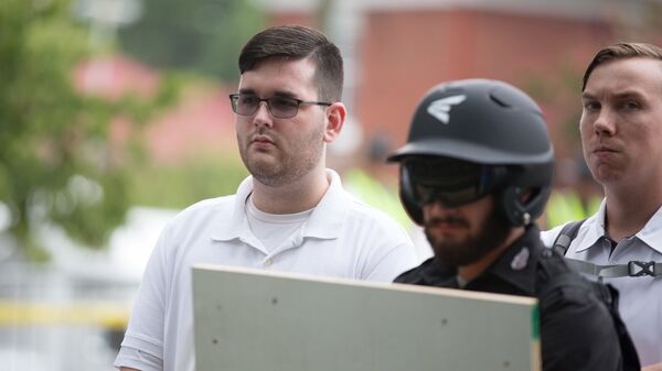 James Alex Fields Jr., (L) is seen attending the Unite the Right rally in Emancipation Park before being arrested by police and charged with charged with one count of second degree murder, three counts of malicious wounding and one count of failing to stop at an accident that resulted in a death after police say he drove a car into a crowd of counter-protesters later in the afternoon in Charlottesville, Virginia, U.S - Sputnik International