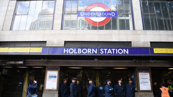 London Underground workers stand outside Holborn Station, that was temporarily closed following a fire alert, in central London Britain August 15, 2017 - Sputnik International