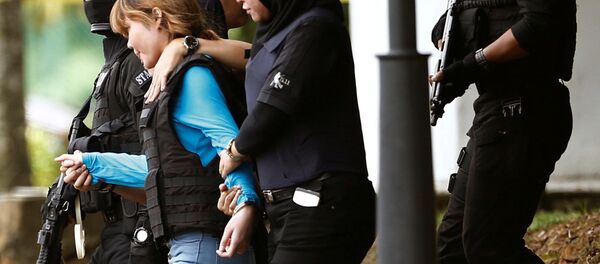 Vietnamese Doan Thi Huong, who is charged for the murder of Kim Jong Nam, is escorted by police as she leaves Sepang court in Malaysia April 13, 2017. - Sputnik International