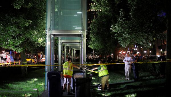 Workers clean up broken glass after the Holocaust Memorial was vandalized in Boston, Massachusetts, U.S., August 14, 2017 - Sputnik International
