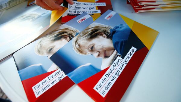 Brochures, showing German Chancellor Angela Merkel, top candidate of the Christian Democratic Union Party (CDU) are seen during an election rally for the upcoming federal elections in Gelnhausen, near Frankfurt, Germany August 14, 2017 - Sputnik International