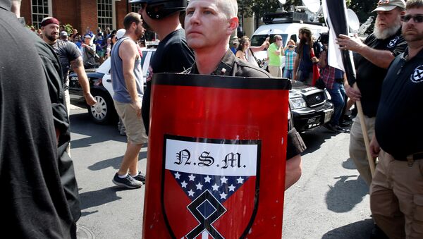 A white supremacist arrives at a rally in Charlottesville, Virginia, US, August 12, 2017. - Sputnik International