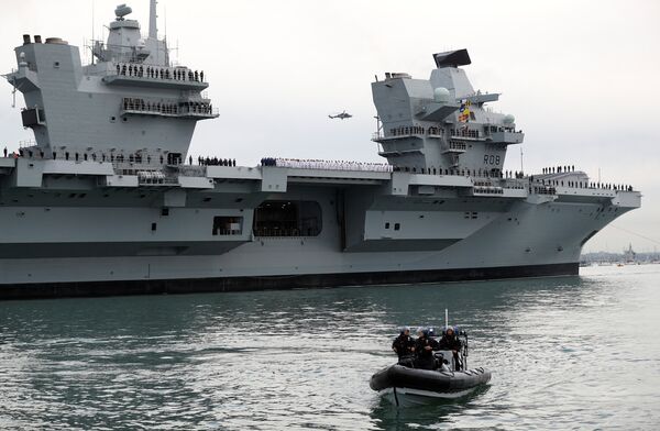 The Royal Navy's new aircraft carrier HMS Queen Elizabeth arrives in Portsmouth, Britain August 16, 2017 - Sputnik International