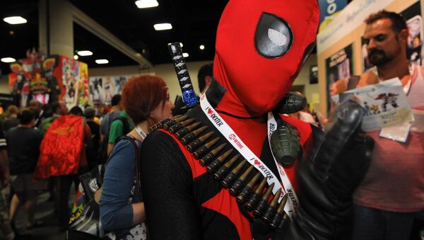 Jonah Duhe, dressed as Deadpool, waits in line during the Preview Night event on Day 1 of the 2013 Comic-Con International Convention on Wednesday, July 17, 2013 in San Diego. - Sputnik International