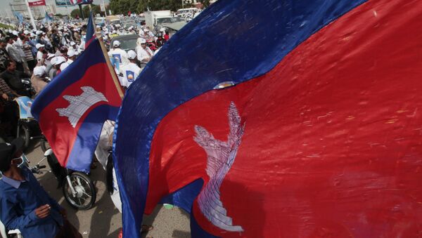 Cambodian National flags flutter over an opposition party supporters of the Cambodia National Rescue Party (CNRP) during the last day of campaigning ahead of communal elections, in Phnom Penh, Cambodia, Friday, June 2, 2017 - Sputnik International