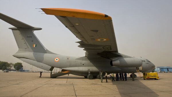 Indian Air Force personnel stand near an IL 76 aircraft as they prepare for departure with relief materials, including tents, blankets and medicines, for cyclone-affected Myanmar, at the airport in New Delhi, India, Thursday, May 8, 2008 - Sputnik International