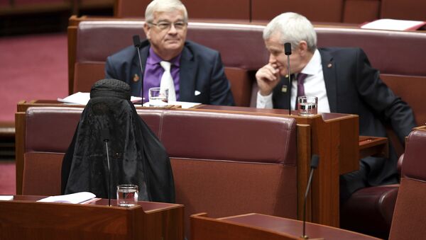 Sen. Pauline Hanson, bottom left, wears a burqa during question time in the Senate chamber at Parliament House in Canberra, Australia, Thursday, Aug. 17, 2017. - Sputnik International