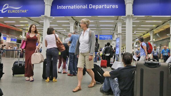In this Thursday, July 2, 2015 file photo, people queue as they wait at the St. Pancras international train station terminal in London - Sputnik International
