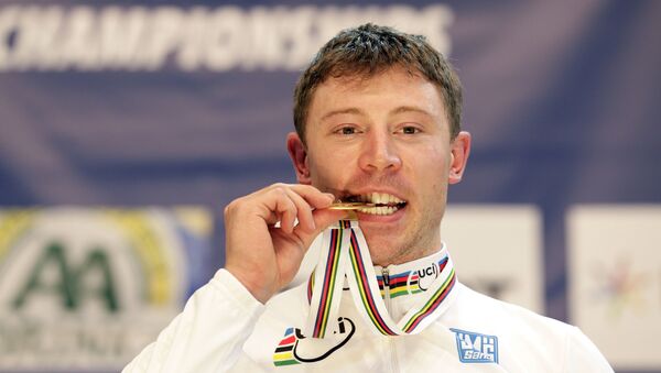 Shane Perkins from Australia celebrates on the podium after winning the men's Keirin final at the UCI Track Cycling World Championships in Apeldoorn, on March 26, 2011 - Sputnik International