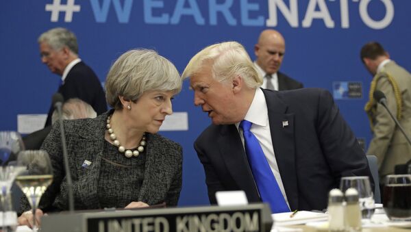 British Prime Minister Theresa May, left, speaks to U.S. President Donald Trump during a working dinner meeting at the NATO headquarters during a NATO summit of heads of state and government in Brussels on Thursday, May 25, 2017. - Sputnik International