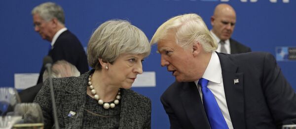 British Prime Minister Theresa May, left, speaks to U.S. President Donald Trump during a working dinner meeting at the NATO headquarters during a NATO summit of heads of state and government in Brussels on Thursday, May 25, 2017. - Sputnik International