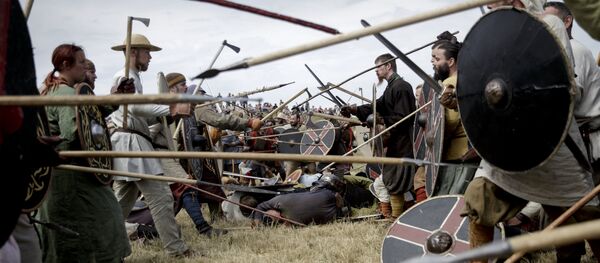 Around 200 people dressed as Vikings simulate a battle during the Viking Festival at Trelleborg, the Viking fortress of King Harald Bluetooth from around year 980 ad, near Slagelse, south-west of Copenhagen, on Friday July 17, 2015 Around 200 people dressed as Vikings simulate a battle during the Viking Festival at Trelleborg, the Viking fortress of King Harald Bluetooth from around year 980 ad, near Slagelse, south-west of Copenhagen, on Friday July 17, 2015 - Sputnik International