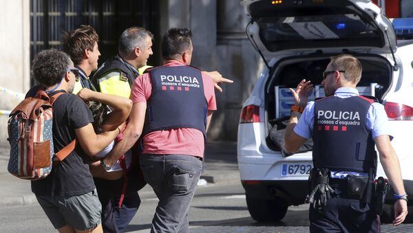 An injured person is carried in Barcelona, Spain, Thursday, Aug. 17, 2017, after a white van jumped the sidewalk in the historic Las Ramblas district, crashing into a summer crowd of residents and tourists and injuring several people, police said - Sputnik International