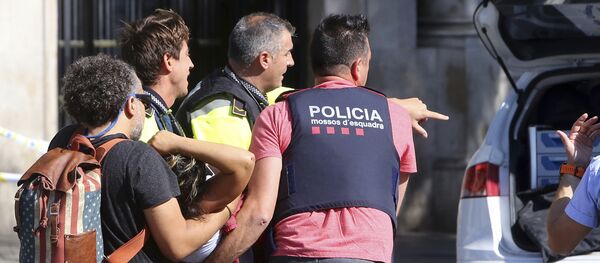 An injured person is carried in Barcelona, Spain, Thursday, Aug. 17, 2017, after a white van jumped the sidewalk in the historic Las Ramblas district, crashing into a summer crowd of residents and tourists and injuring several people, police said - Sputnik International