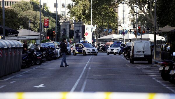 A street is cordoned off after a van crashed into pedestrians near the Las Ramblas avenue in central Barcelona, Spain August 17, 2017. - Sputnik International