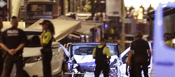 Police officers stand next to the van involved on an attack in Las Ramblas in Barcelona, Spain, Thursday, Aug. 17, 2017. Police officers stand next to the van involved on an attack in Las Ramblas in Barcelona, Spain, Thursday, Aug. 17, 2017. - Sputnik International
